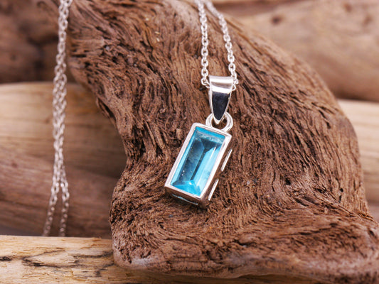 Sterling Silver Blue Topaz Emerald Cut Elegance Pendant with Silver Trace Necklace