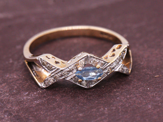 9ct Yellow Gold Blue Topaz & Diamond Cross Over Ring Size O British Made