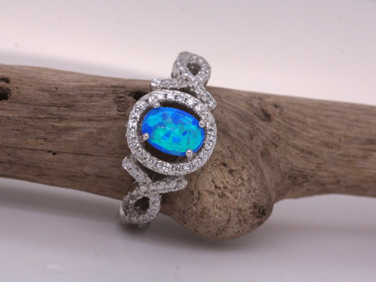 BJC® Sterling Silver Fiery Blue Opal & Cubic Zirconia Oval Solitaire CZ Ring Size J