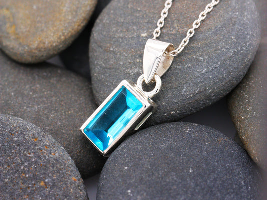 Sterling Silver Blue Topaz Emerald Cut Elegance Pendant with Silver Trace Necklace